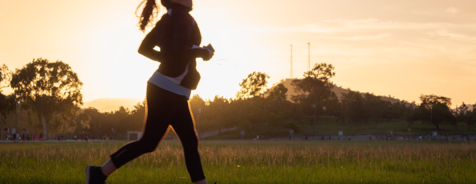 A runner outdoors at sunset